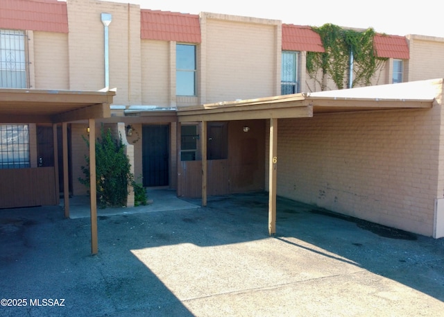 entrance to property with a carport