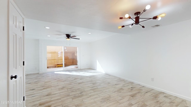 spare room featuring light hardwood / wood-style flooring and ceiling fan