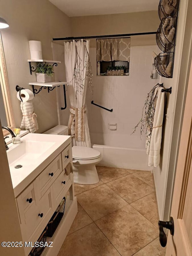 full bathroom with shower / tub combo with curtain, vanity, tile patterned floors, and toilet