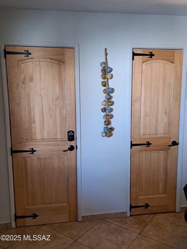 entryway with light tile patterned floors