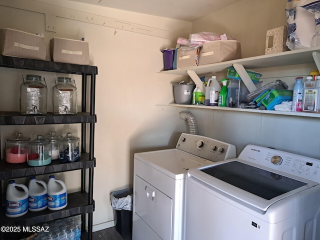 laundry area with washing machine and clothes dryer