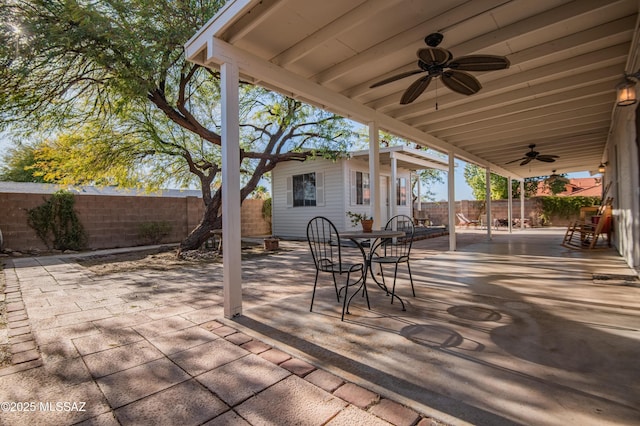 view of patio / terrace with an outdoor structure and ceiling fan