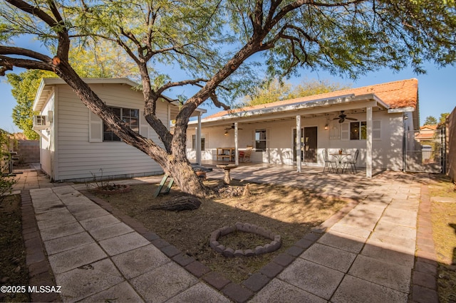 back of house featuring a patio area and ceiling fan