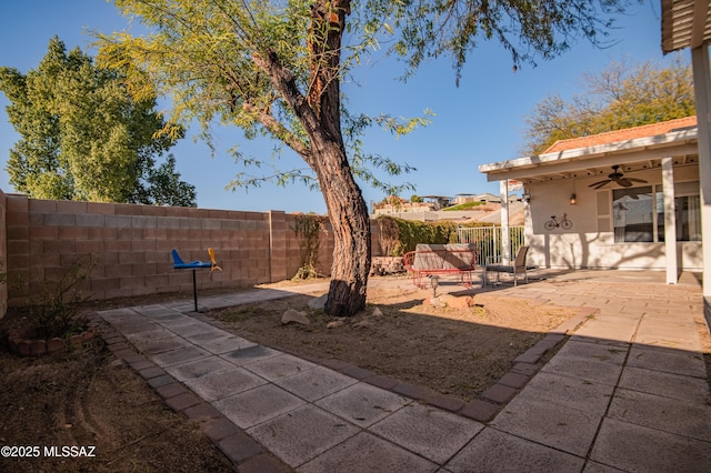 view of patio / terrace featuring ceiling fan