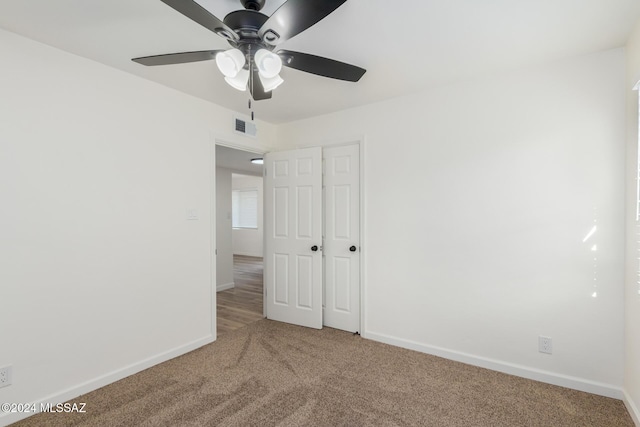 unfurnished room featuring carpet