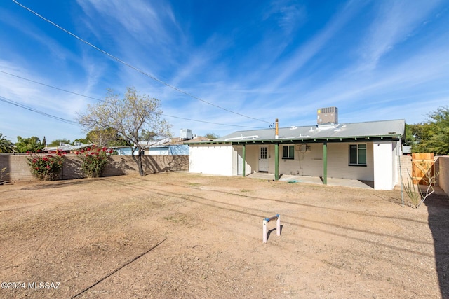 back of property featuring a patio and cooling unit