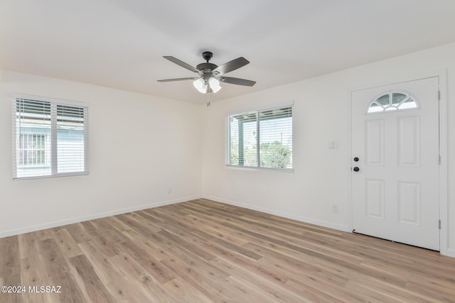 entrance foyer with ceiling fan and light wood-type flooring