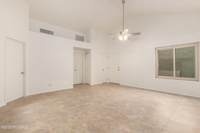 unfurnished room featuring ceiling fan and high vaulted ceiling