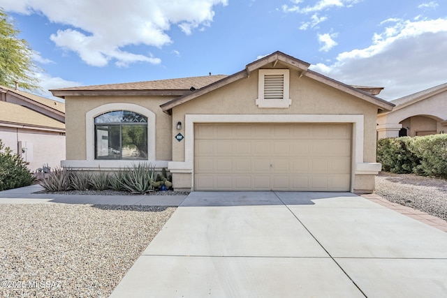 ranch-style house featuring a garage