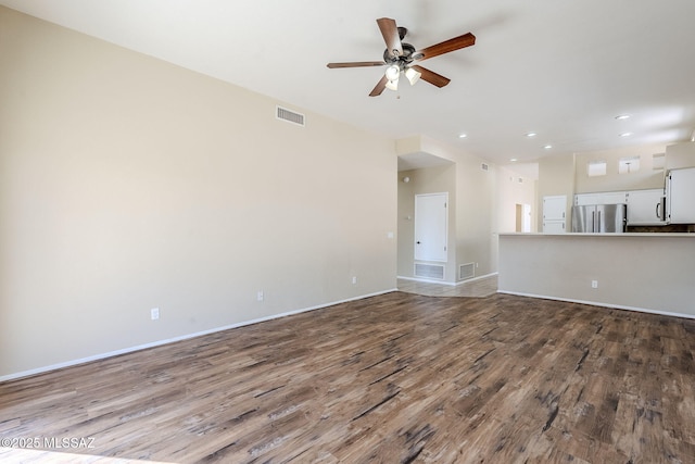 unfurnished living room featuring hardwood / wood-style flooring and ceiling fan