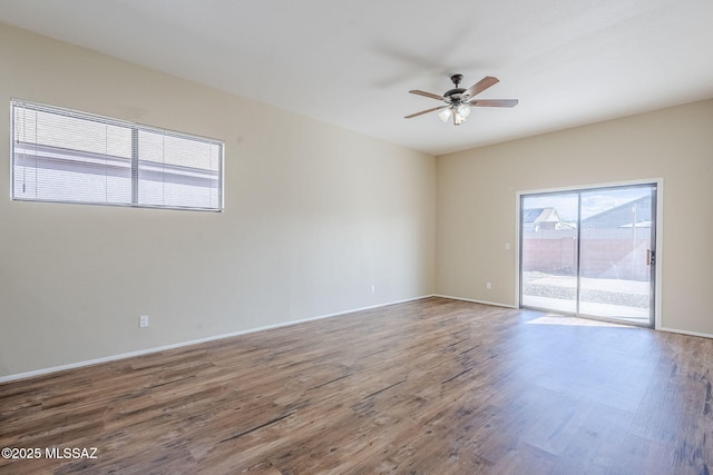 empty room featuring hardwood / wood-style flooring and ceiling fan