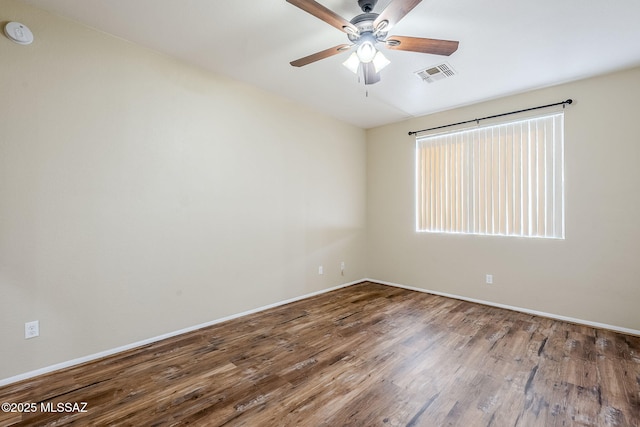 empty room featuring hardwood / wood-style floors and ceiling fan