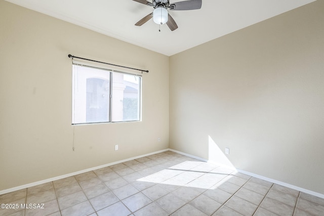 empty room featuring ceiling fan and light tile patterned floors