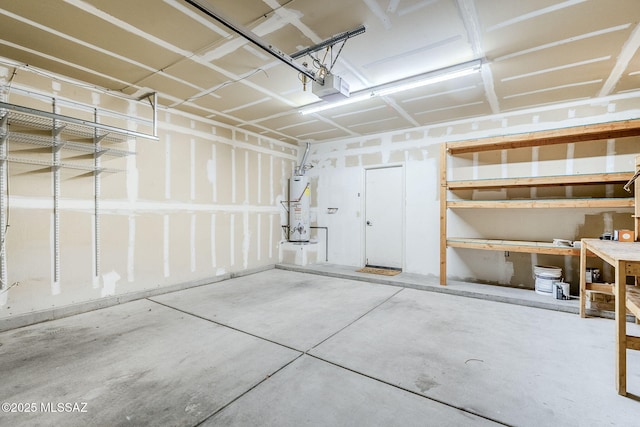 garage featuring a garage door opener and water heater