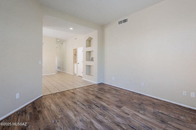 spare room with light wood-type flooring