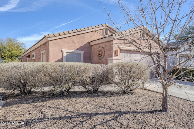 view of home's exterior featuring a garage