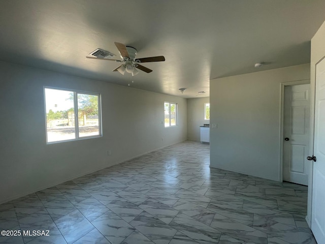 2221 S Sahuara Ave, Tucson, AZ 85711 - empty room with ceiling fan, visible vents, baseboards, and marble finish floor
