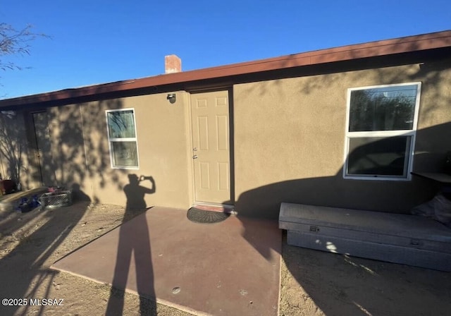 2221 S Sahuara Ave, Tucson, AZ 85711 - back of property with a patio area and stucco siding