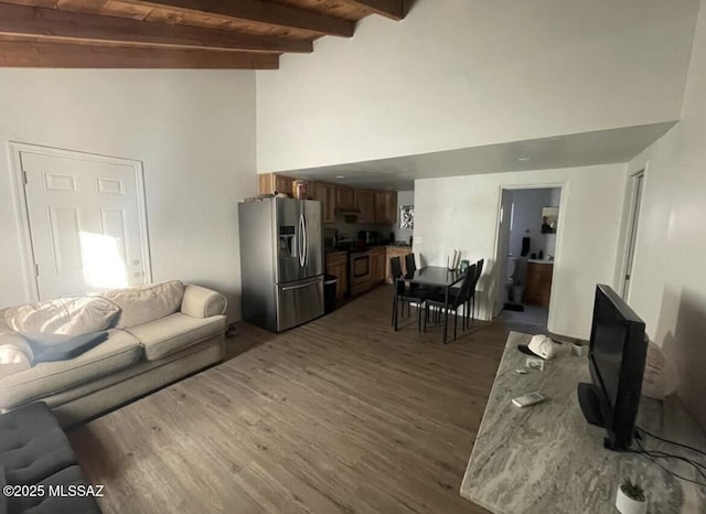 2221 S Sahuara Ave, Tucson, AZ 85711 - living area featuring high vaulted ceiling, beamed ceiling, and dark wood finished floors
