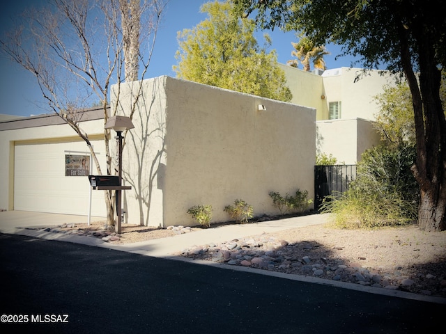 view of side of property featuring a garage