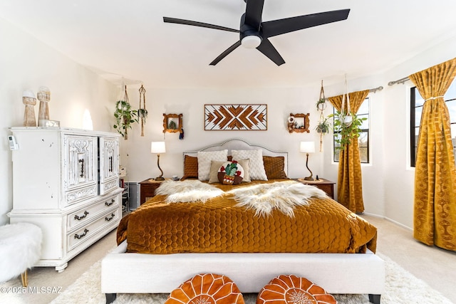 bedroom featuring ceiling fan and light colored carpet