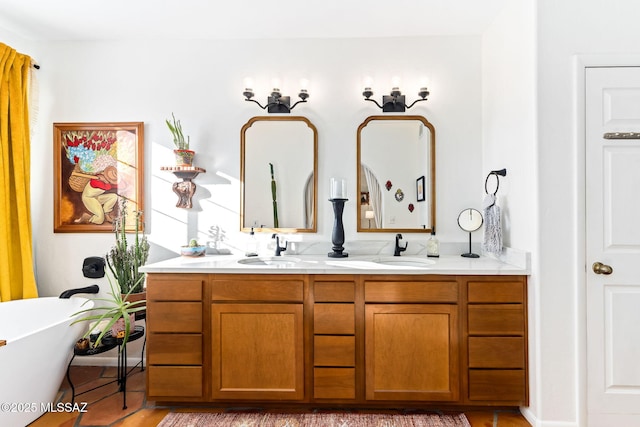 bathroom with vanity and a bath