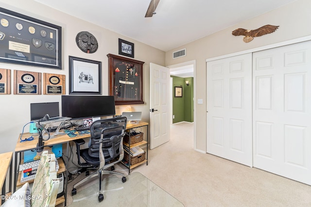 office area featuring light colored carpet