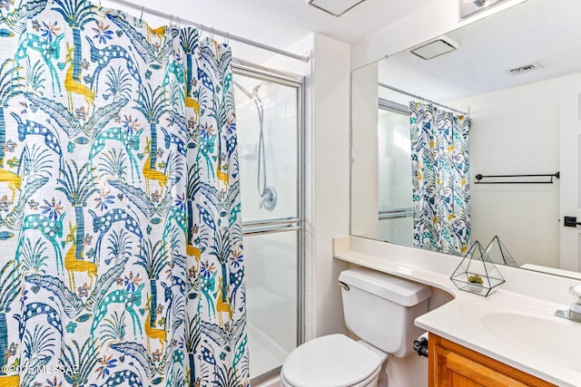 bathroom with vanity, toilet, and curtained shower