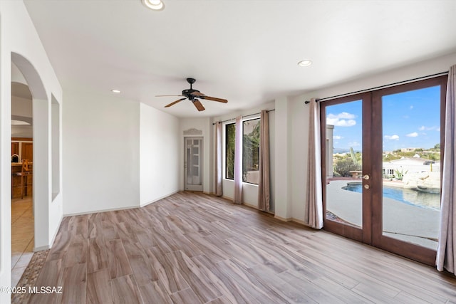 empty room featuring light hardwood / wood-style flooring and french doors