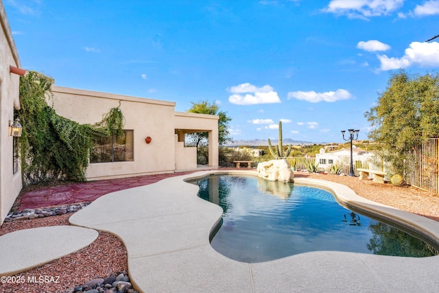 view of swimming pool with a patio