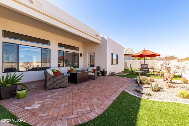 view of patio with fence and an outdoor hangout area