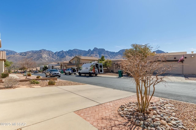 view of street featuring a residential view and a mountain view