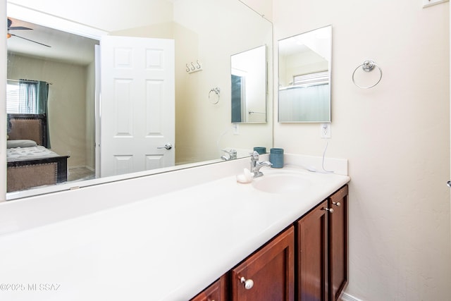 bathroom featuring vanity and ceiling fan