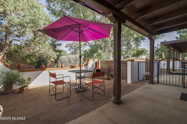 328 S Paseo Pena Unit C, Green Valley, AZ 85614 - view of patio / terrace with fence and outdoor dining space