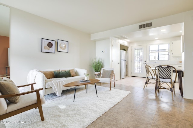 328 S Paseo Pena Unit C, Green Valley, AZ 85614 - living room with visible vents, recessed lighting, and light tile patterned floors