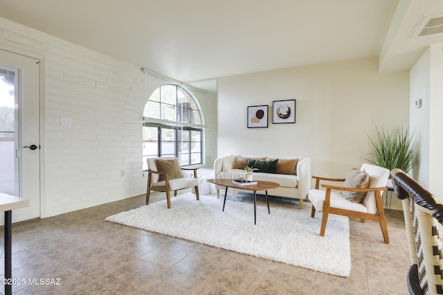 328 S Paseo Pena Unit C, Green Valley, AZ 85614 - living room with visible vents and brick wall