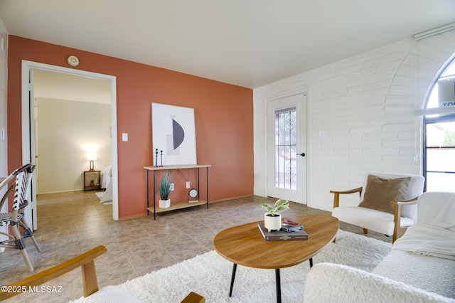 328 S Paseo Pena Unit C, Green Valley, AZ 85614 - living area featuring light tile patterned floors, plenty of natural light, and baseboards