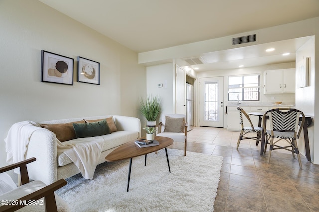 328 S Paseo Pena Unit C, Green Valley, AZ 85614 - living room with light tile patterned floors, recessed lighting, and visible vents