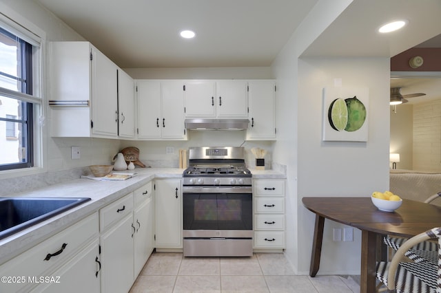 328 S Paseo Pena Unit C, Green Valley, AZ 85614 - kitchen with a wealth of natural light, light countertops, stainless steel gas stove, and under cabinet range hood