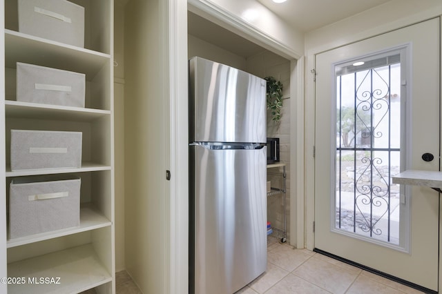328 S Paseo Pena Unit C, Green Valley, AZ 85614 - kitchen with light tile patterned flooring and freestanding refrigerator
