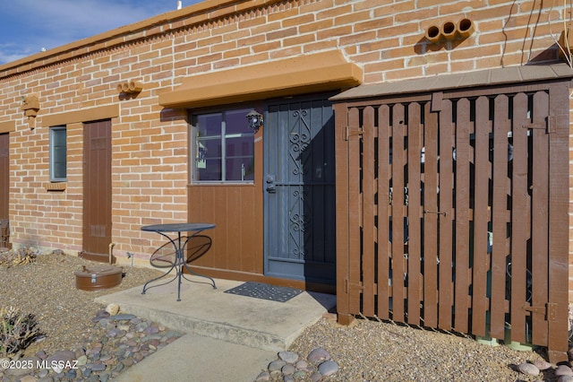 328 S Paseo Pena Unit C, Green Valley, AZ 85614 - doorway to property featuring brick siding