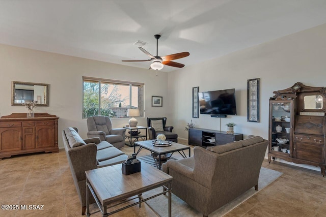 tiled living room featuring ceiling fan