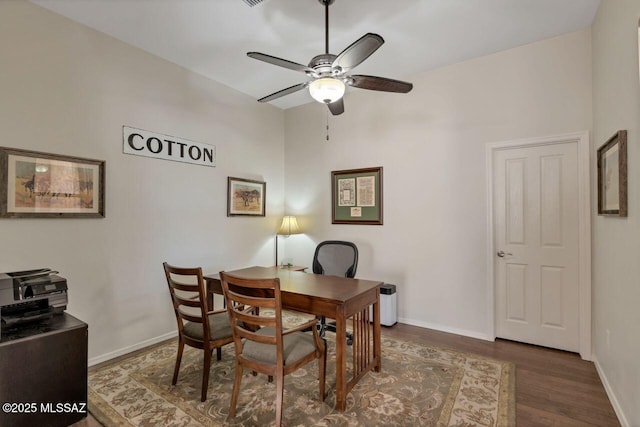 office area with wood finished floors, baseboards, and ceiling fan