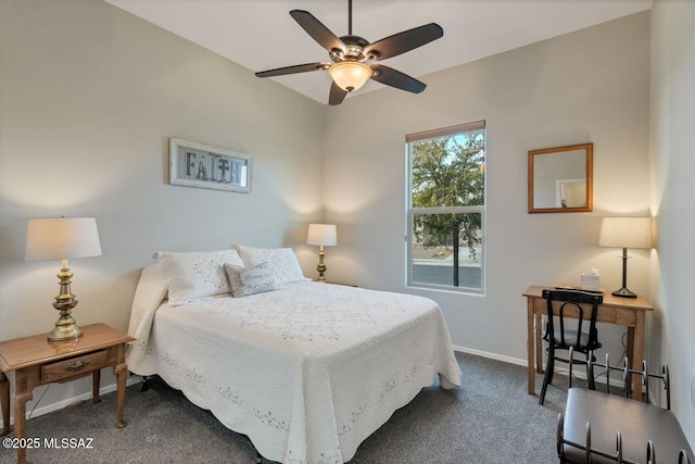 bedroom featuring dark carpet, a ceiling fan, and baseboards