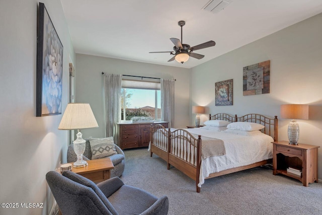 bedroom with carpet, visible vents, and a ceiling fan