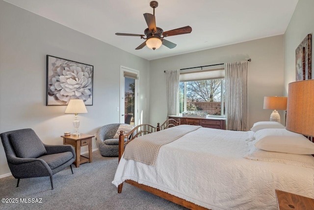 carpeted bedroom featuring baseboards and ceiling fan