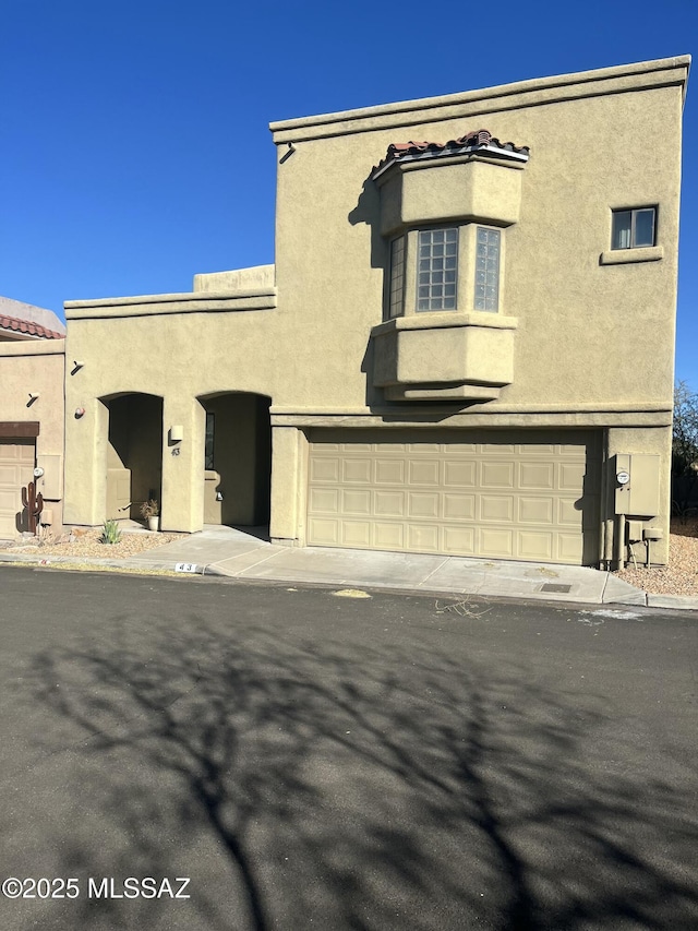 view of front of property with a garage