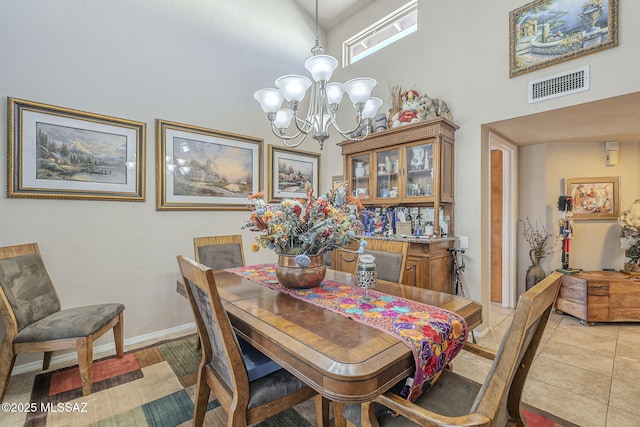 3910 S Via Del Ruisenor, Green Valley, AZ 85622 - dining area with an inviting chandelier, light tile patterned flooring, and a high ceiling