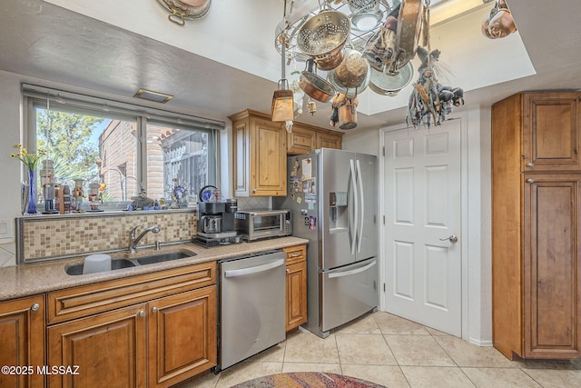 3910 S Via Del Ruisenor, Green Valley, AZ 85622 - kitchen with light tile patterned flooring, appliances with stainless steel finishes, sink, and backsplash