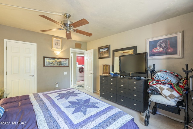 3910 S Via Del Ruisenor, Green Valley, AZ 85622 - bedroom featuring washer / clothes dryer, light carpet, and ceiling fan